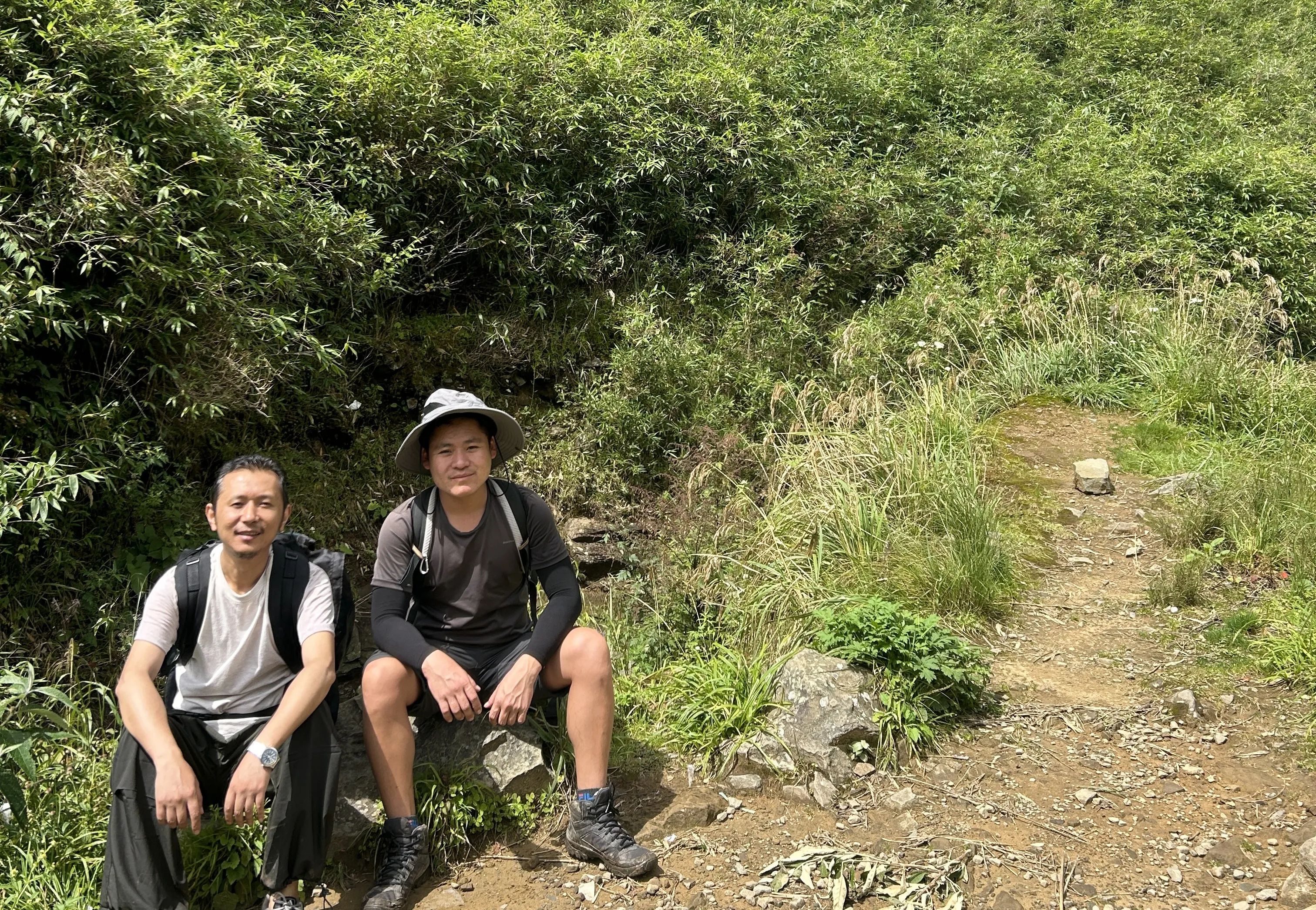 Tenzing and our guide Puno on the way down Dzukou Valley Trek