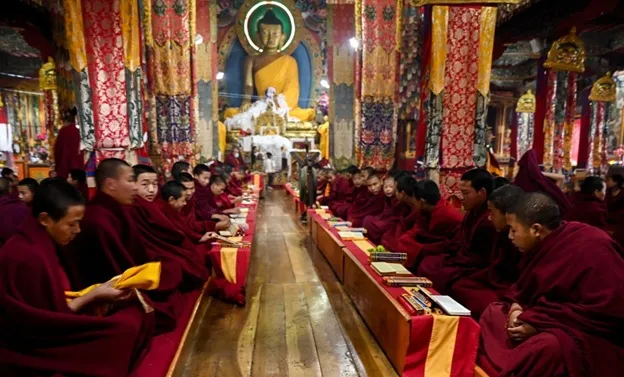 Monks praying inside Tawang Monastery
